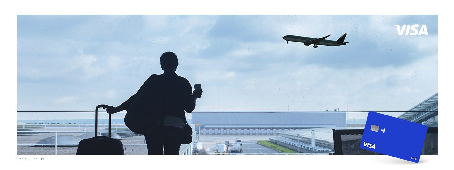 A woman with a suitcase in an airport and a Visa card on a foreground