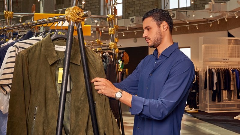 A man in a fashionable apparel shop